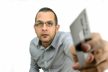 modern man businessman in a shirt giving a credit card in front