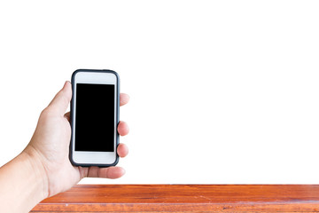 Smart phone in male hands over table