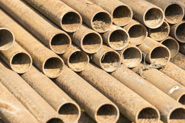 Stack of rusty steel pipes.