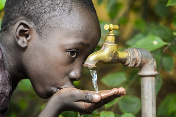 Water is Life! African Baby Boy Drinking Water (Drought Symbol)