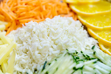 Different vegetables, grated on a grater shaped.