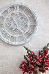 red amaryllis in vase with Christmas decorations