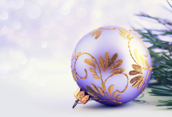 Gold xmas decoration on glitter holiday background. Xmas and New Year card