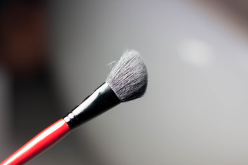 Brush with red stick