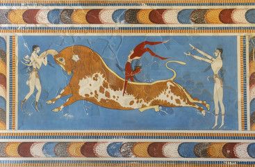 Famous a bull-leaping scene, two white-skined women and a brown-skined man from the Knossos Palace, 1600-1450 BC. Knossos is the largest archaeological site of Crete.