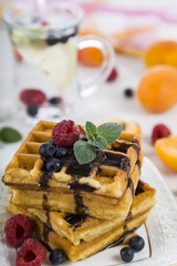 Delicious waffle with berries and chocolate