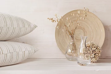 Foto op Aluminium Soft home decor of  glass vase with spikelets and pillows on white wood background. Interior. © finepoints