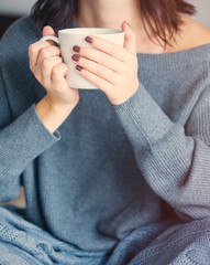 woman with of coffee or tea at home