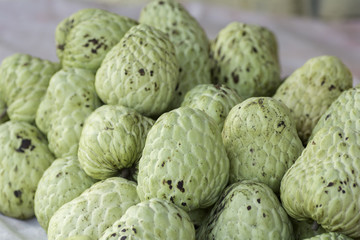 custard apple fruit to sell at the market .