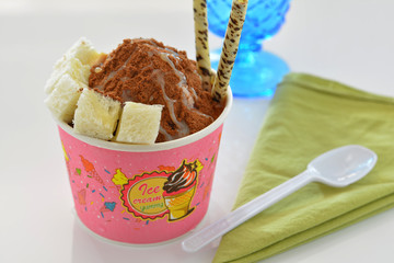 Shaved Ice dessert with breads and cocoa powder.