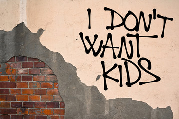 I Don't Want Kids - handwritten graffiti sprayed on the wall, anarchist aesthetics - voluntary...