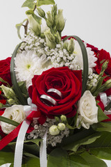 wedding rings with bridal bouquet 