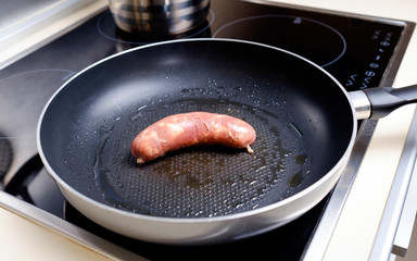 Sausages cooking