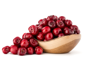 cherry berries in wooden bowl