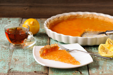 Lemon pie with fresh and squeezed lemon, cup of tea