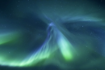 Naklejka na ściany i meble Beautiful northern light aurora borealis in the night sky of Iceland
