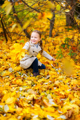 Little girl outdoors on autumn day