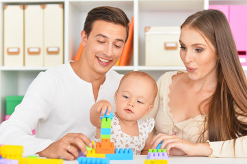 Fototapeta premium Happy family playing at home