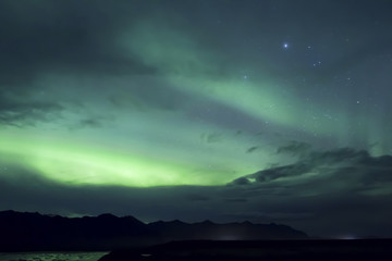 Naklejka na ściany i meble Aurora Borealis beautiful northern light in the clear night sky, Iceland
