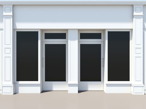 Shopfront with two doors and large windows. White store facade.