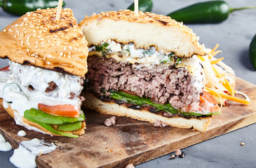 Gourmet burger with spinach and spicy jalapenos
