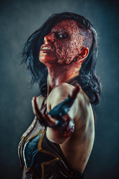 Portrait of Zombie woman with the blood on the face