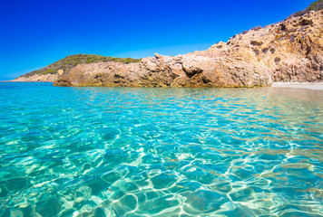 Fototapeta na wymiar Sandy beach with rocks in Corsica, France.
