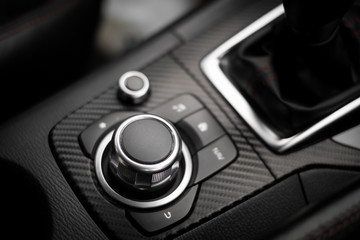 Detail of Multi function buttons and audio buttons in a modern car