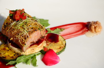 Roasted pork tenderloin with walnut and peppercorn crust.