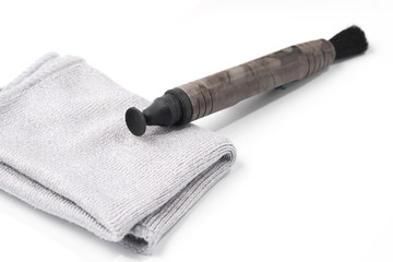 Details of Lens pen for lens optic cleaning isolated on white background.