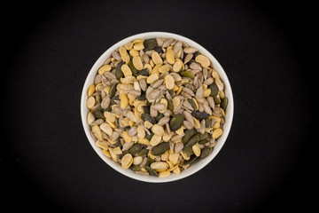 mixed seeds in wooden bowl
