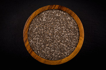 Chia seeds in wooden bowl
