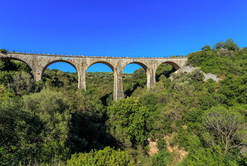 Fototapeta na wymiar old railroad arch bridge on Peloponnese, Greece