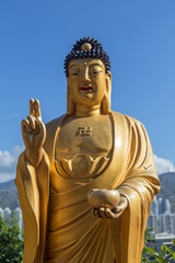 Closeup of a smiling Buddha statue at the Ten Thousand Buddhas Monastery (Man Fat Tsz) in Sha Tin (Shatin), Hong Kong, China.
