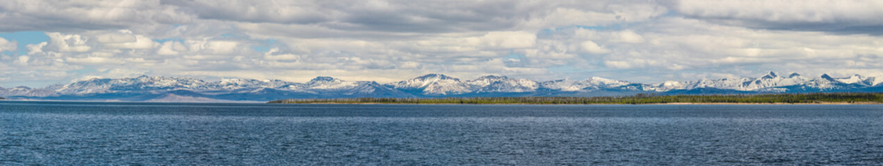 Panorama of snowcapped mountains with lake in Yellowstone national park