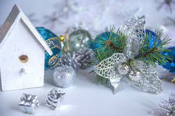 Christmas and New Year composition with green fir tree branch with beautiful silver decorations