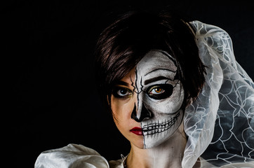 dead bride on a black background in studio