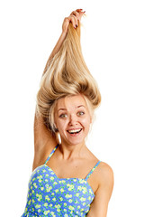 Portrait of a beautiful cheerful young woman showing a healthy long hair