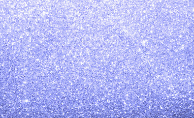 Light blue sparkle glittering abstract background.  Colorful shine and twinkle backdrop