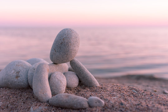 Figurine on seashore