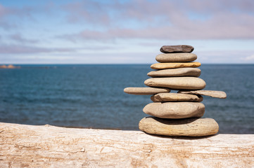 Stone stack on beach with faded retro filter