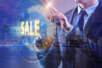 Young handsome businessman in sales concept