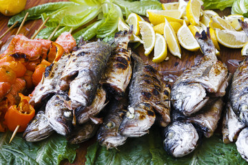 Fish Grill on lettuce leaves. Street food