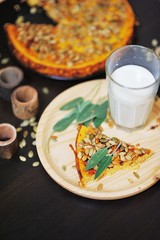 a piece of pumpkin pie and a glass of milk