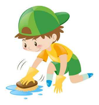 Boy cleaning the floor with brush