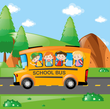 Four kids riding on school bus