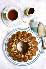 Pumpkin oat cake with caramel and walnuts.Top view.