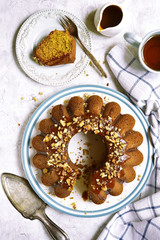 Pumpkin oat cake with caramel and walnuts.Top view.