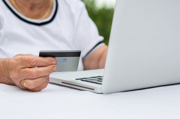 Senior Adult Holding Credit Card Concept