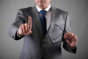 Businessman pressing buttons in business concept